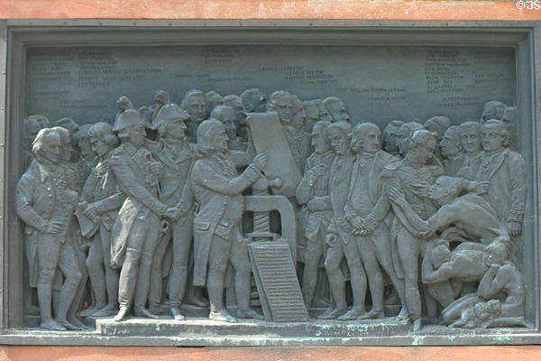 Relief of impact of printing on base of Statue of Guttenberg showing signing of American Declaration of Independence & distribution of printed copies. Strasbourg, France.
