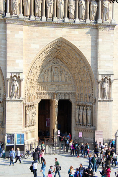 Right Gothic portal of Notre Dame Cathedral. Paris, France.