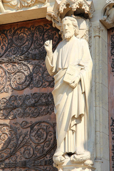 Christ carving on middle pillar of center portal of Notre Dame Cathedral. Paris, France.