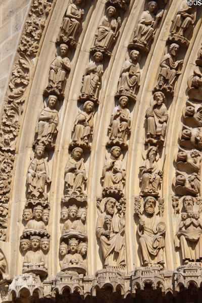 Saints carvings on center portal of Notre Dame Cathedral. Paris, France.