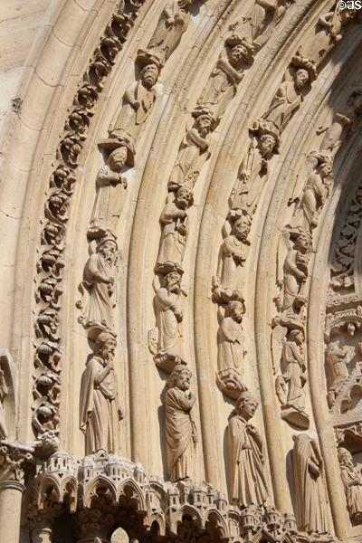 Saints carvings on right portal of Notre Dame Cathedral. Paris, France.