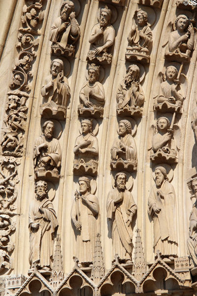 Saints carvings on left portal of Notre Dame Cathedral. Paris, France.