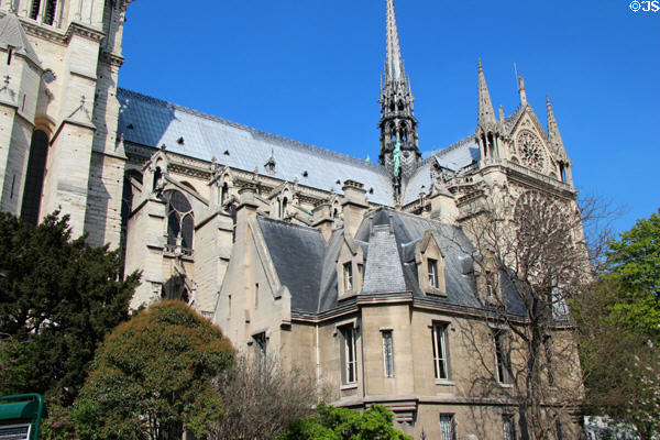South side of Gothic Notre Dame Cathedral with Renaissance house addition. Paris, France.