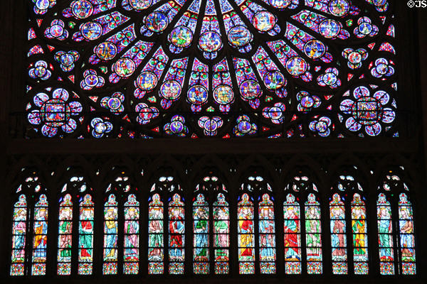 Rose window of Virgin & Child circle by old testament figures over vertical windows of kings in north transept of Notre Dame Cathedral. Paris, France.