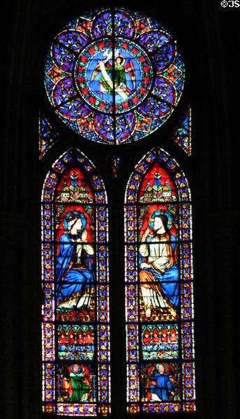 Queen praying to Christ stained glass window in Notre Dame Cathedral. Paris, France.