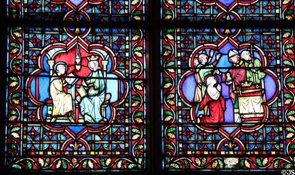 Crowning of king stained glass window in Notre Dame Cathedral. Paris, France.