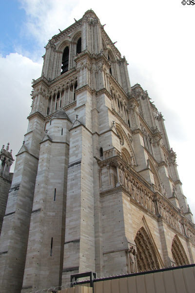 Western towers of Notre Dame Cathedral under restoration after fire of 2019. Paris, France.
