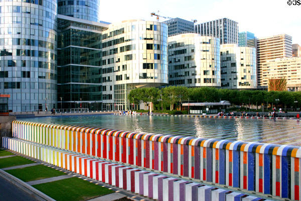 Defense Place pool with rainbow walls with base of Cœur Défense (2001) building beyond at La Défense. Paris, France.