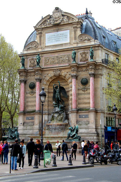 St-Michel Fountain affixed to end wall of building as part of vista plan by Baron Haussmann. Paris, France.