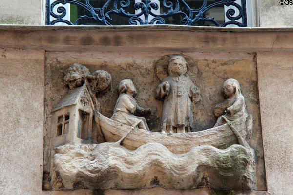 Medieval carving in Latin Quarter of saint in rowboat. Paris, France.