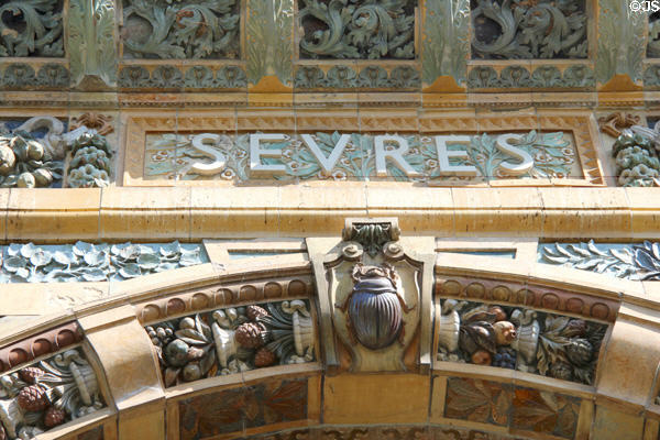 Detail of Art Nouveau name & scarab beetle on Sevres Arch (1900) at St-Germain-des-Prés. Paris, France.