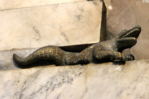 Brass crocodile on base of Gnomon obelisk at St-Sulpice church. Paris, France.