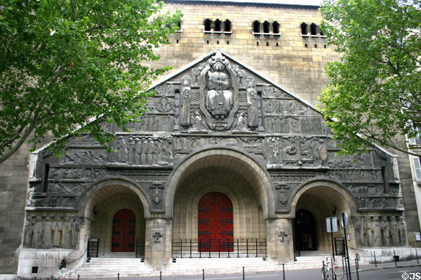 St Pierre de Chaillot (1938) (31 Avenue Marceau) facade carved with life story of St Peter. Paris, France. Style: Romanesque Revival.