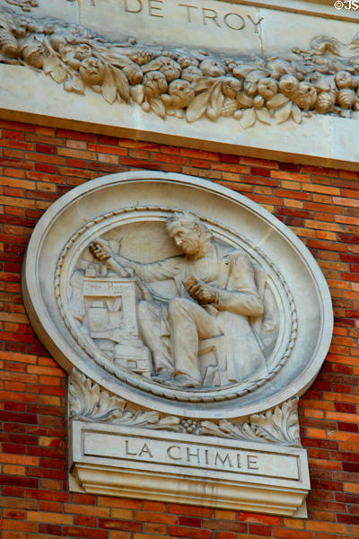 Relief roundel features chemistry of tapestry making c1912 by Jean Hugues at Gobelins Manufactory building. Paris, France.