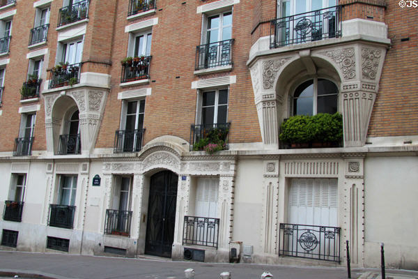 Ornate building at 71 Rue Lepic on Montmartre. Paris, France.