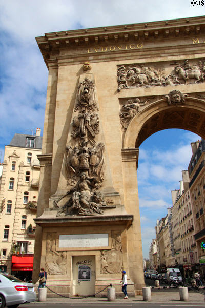 Roman victory symbols carved (1672) in Baroque style by François Giradon & Michel Anguier on Port St.-Denis mark Louis XIV's victories during his Rhine Battles & taking of Maastricht. Paris, France.