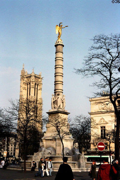 Napoleon's victory column water fountain called Fontaine du Palmier (1806-8) at Place du Châtelet with Tour St Jacques beyond. Paris, France.