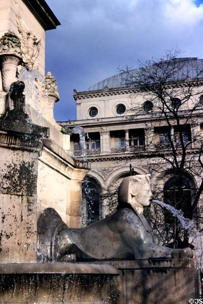 Fontaine du Palmier sphinx celebrating Napoleon's Egyptian victories at Place du Châtelet with Théâtre de la Ville beyond. Paris, France.