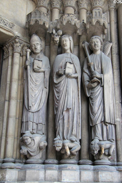Figures carved on pillar at Saint-Germain-l'Auxerrois. Paris, France.