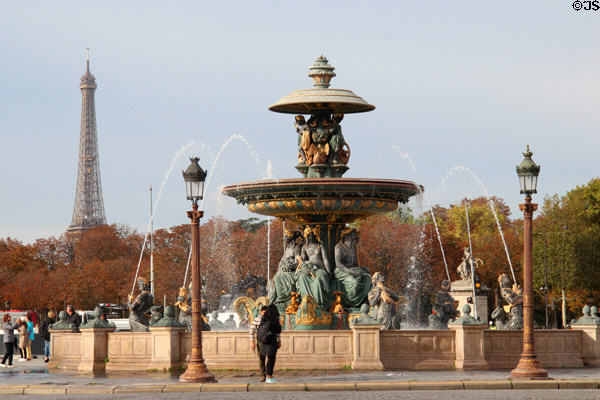 Fountain of Rivers marks navigation & commerce on rivers of France (1840) by Jacques Ignace Hittorff in northern position on Place de la Concorde with Eiffel Tower beyond. Paris, France.