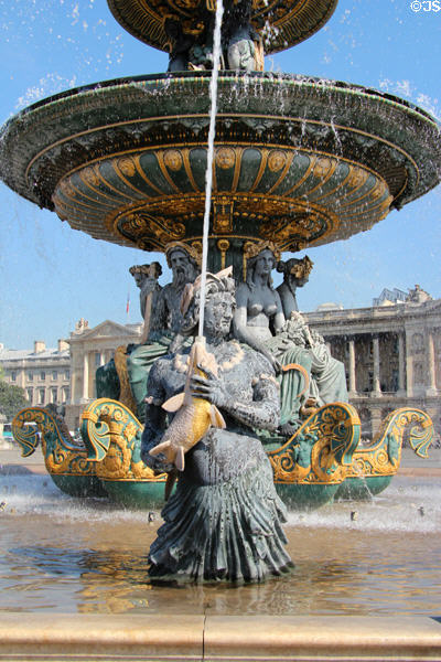 River creature holding squirting fish detail of Fountain of Rivers (1840) by Jacques Ignace Hittorff in northern position on Place de la Concorde. Paris, France.