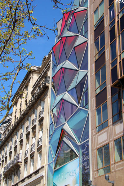 Faceted window wall of former Citroen auto showroom on Champs Elysees. Paris, France.