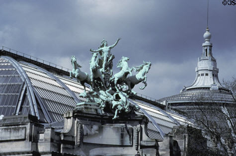 Quadriga bronze statue of four horses pulling a god on chariot by Récipon atop Grand Palais. Paris, France. Style: Art Nouveau.