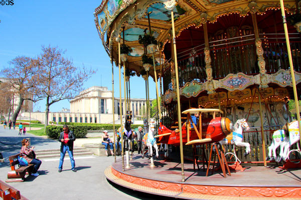 Two levels structure featuring biplane & horses on Trocadero Carrousel. Paris, France.