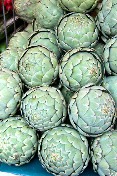 Stack of artichokes in food stall. Paris, France.
