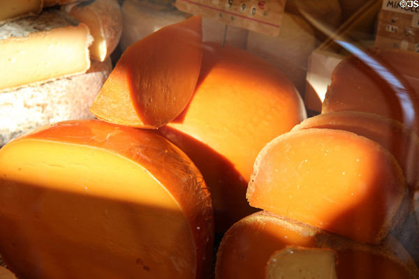 Round hard cheeses in shop. Paris, France.