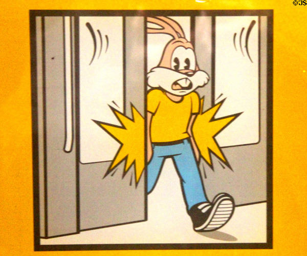 RATP metro train rabbit warning sign not to walk between closing doors. Paris, France.