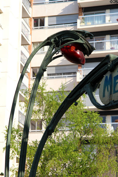 Flower light of Paris Metro entrance likened to lily-of-the-valley. Paris, France. Architect: Hector Guimard.