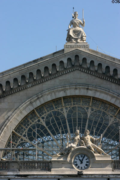 Gare de l'Est rail station with sculptures symbolizing of Strasbourg by Henri Lemaire & Rhein & Seine Rivers by Jean-Louis Brian over clock. Paris, France.
