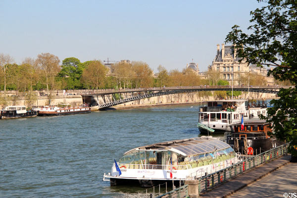 Two level Passerelle Léopold-Sédar-Senghor footbridge over Seine near Louvre. Paris, France.