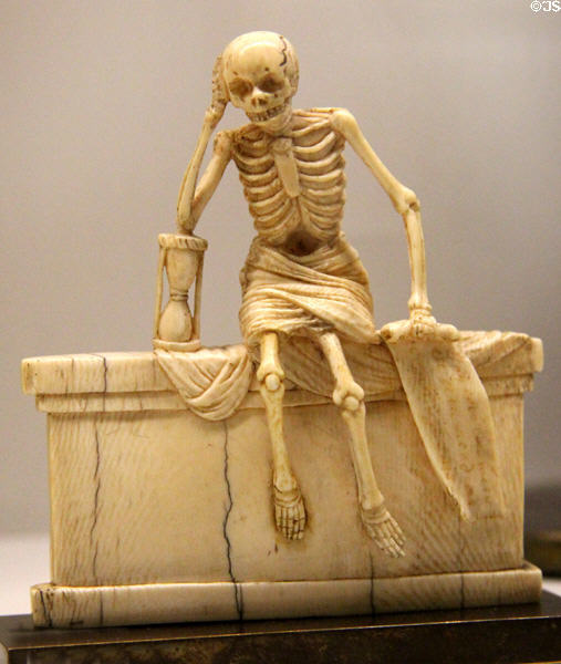 Skeleton in shroud seated on tomb ivory carving (1547) from France at Museum of Decorative Arts. Paris, France.