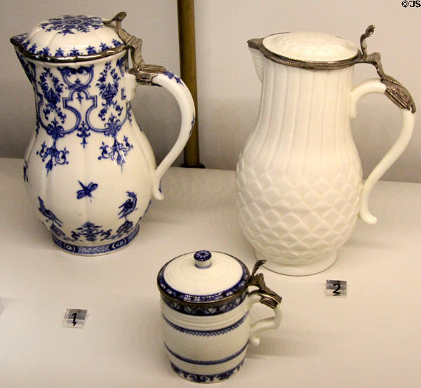 Porcelain water pitchers & mustard pot (1720s) made by Manuf. Saint-Cloud of Paris with silver fittings by Paul le Riche at Museum of Decorative Arts. Paris, France.