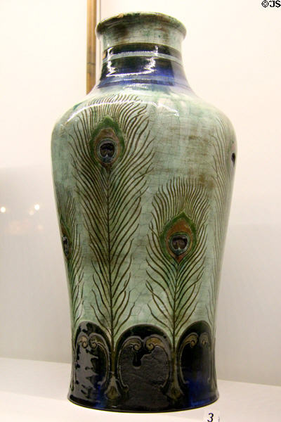 Ceramic vase painted with peacock feathers (c1889) by Auguste Delaherche of Paris (shown Paris Expo 1889) at Museum of Decorative Arts. Paris, France.