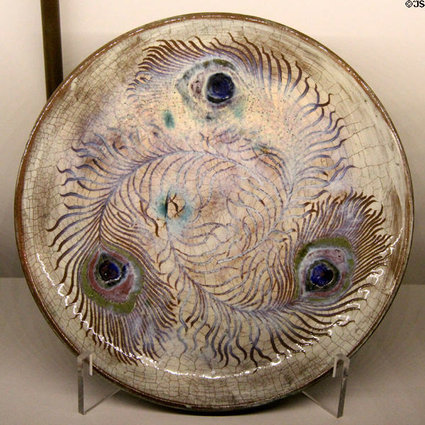 Ceramic plate painted with peacock feathers (c1887-93) by Auguste Delaherche of Paris at Museum of Decorative Arts. Paris, France.