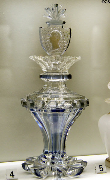 Crystal glass flask with stopper containing ceramic portrait (early 19thC) from France or Bohemia at Museum of Decorative Arts. Paris, France.