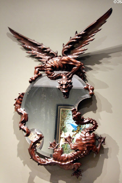 Wall mirror with frame in shape of dragon (c1880) attrib. Gabriel Viardot of Paris at Museum of Decorative Arts. Paris, France.