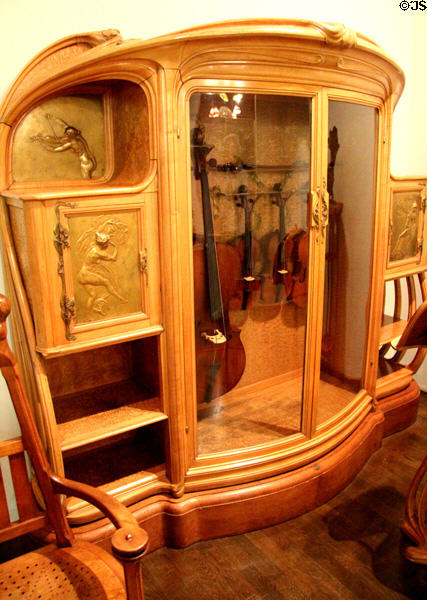 Art Nouveau armoire for string quartet instruments (c1901) by Alexandre Louis-Marie Charpentier of Paris at Museum of Decorative Arts. Paris, France.