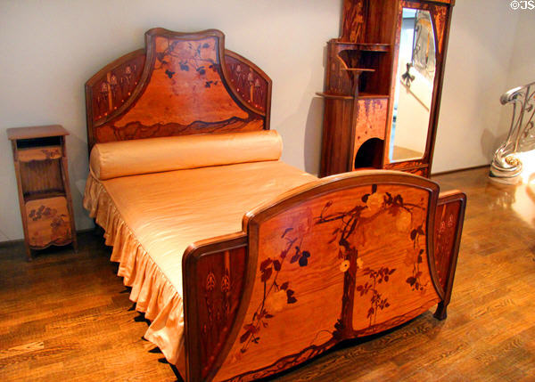 Bed, night stand & mirrored armoire (1900) by Louis Majorelle of Art Nouveau movement of Nancy at Museum of Decorative Arts. Paris, France.