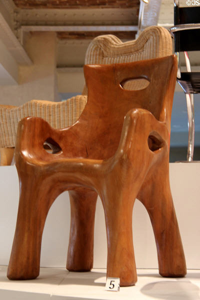 Wooden African-style chair (1946-7) by Alexandre Noll at Museum of Decorative Arts. Paris, France.