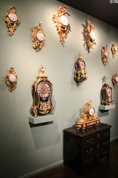 Collection of antique French wall & shelf clocks at Museum of Decorative Arts. Paris, France.