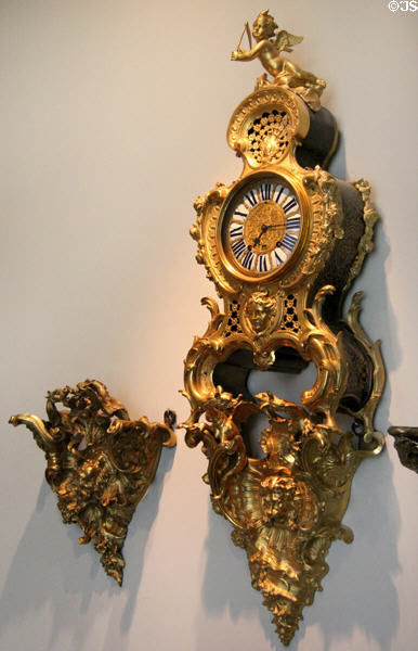 Wall clock (1733-5) with case by Charles Cressent & movement by André-George Guyot of Paris at Museum of Decorative Arts. Paris, France.