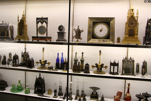 Collection of antique French clocks & other metal objects at Museum of Decorative Arts. Paris, France.