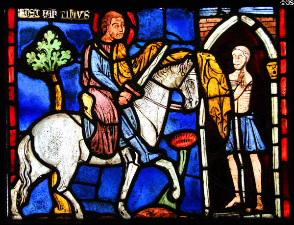 Knight on horseback stained glass window at Cluny Museum. Paris, France.