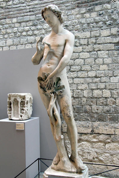 Stone carving of Adam (c1260) from original Notre Dame church of Paris at Cluny Museum. Paris, France.