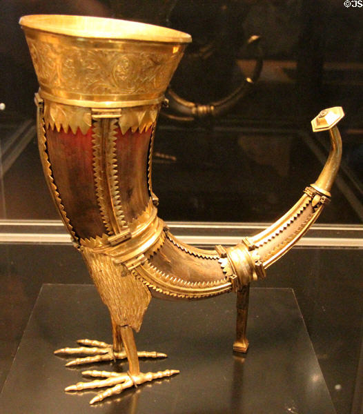 Gilded copper drinking horn in form called claw of griffon (c1500) from Germany at Cluny Museum. Paris, France.