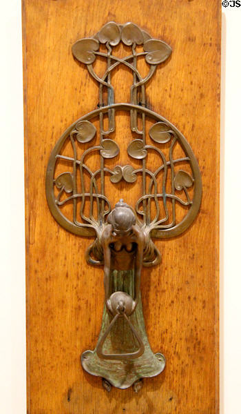 Door knocker in style of Wiener Werkstätte (1897) by Gustav Gurschner of Vienna at Petit Palace Museum. Paris, France.